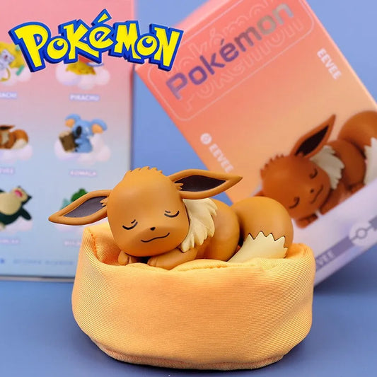Pokémon plush toy with sleeping Eevee design in front of a Pokémon box. Eevee Plushie sleeping on little bean bag